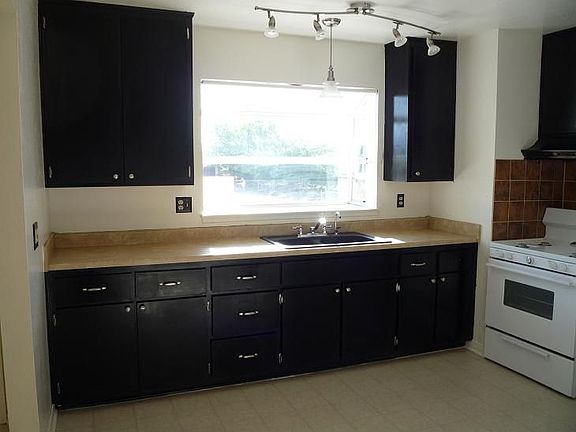 Modernized kitchen with an eat-in country feeling and window garden for herbs.