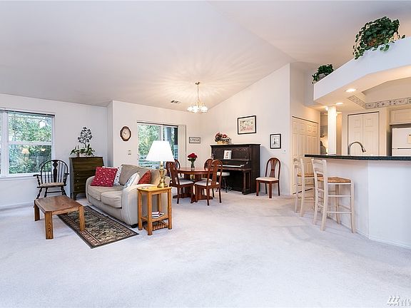 Living/great room, with kitchen on the right, bedrooms/bathrooms down the hall to the right, and dedicated office to the left. 