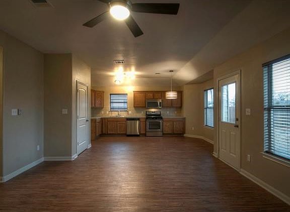 Main living area with kitchen/dining beyond