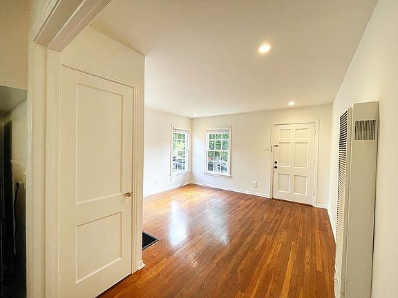 Living room. Front door and closet door.
