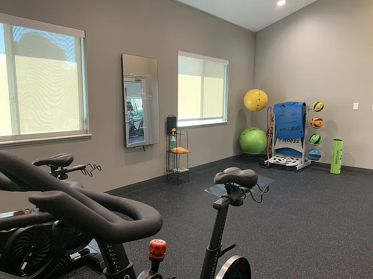 Our fitness center includes a separate room for yoga or spin.