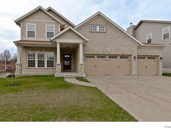 Mainly Brick & Stone Front Elevation with Large Covered Porch - extends out to last stone column