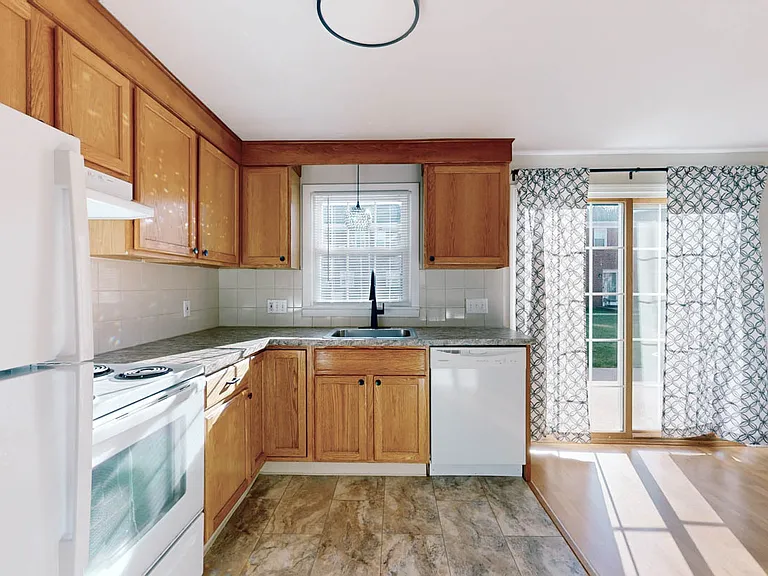 Bright inviting Kitchen with French doors to Patio!