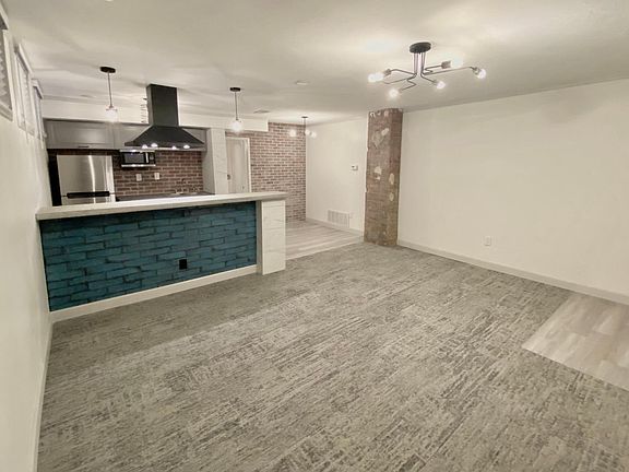 View from living room to dining/kitchen/bar