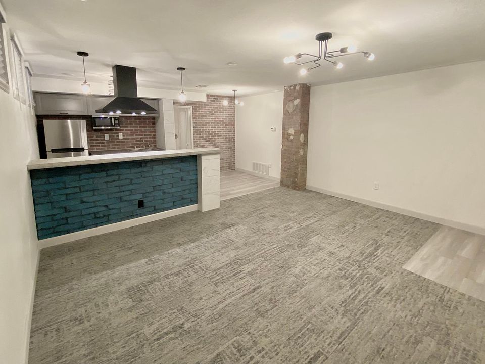 View from living room to dining/kitchen/bar
