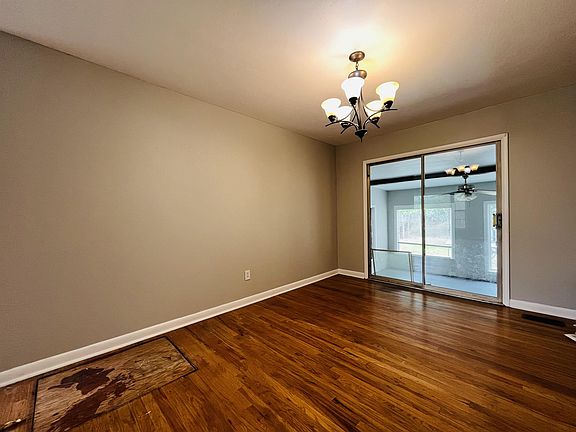 Dining Room with sliding glass doors out to enclosed patio.