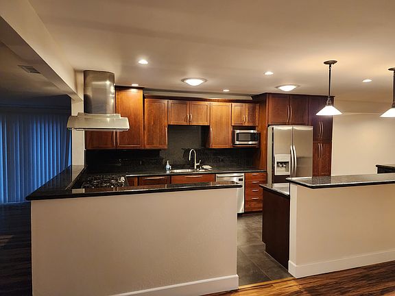 Entryway into kitchen, living room to left.