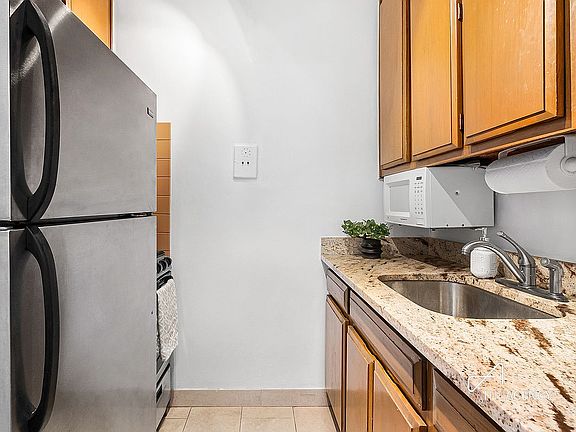 5th image of 115 E 9th St APT 12K