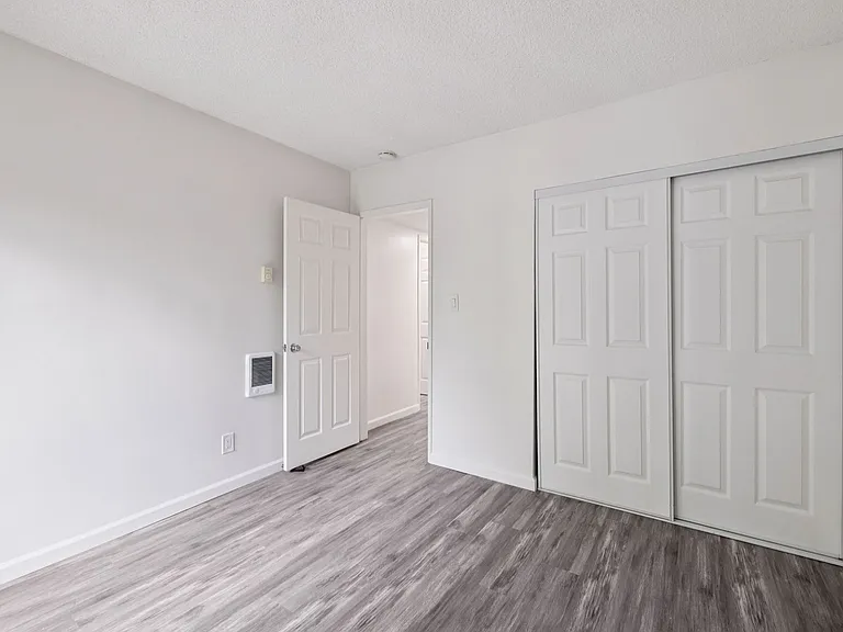 Bedroom with double-door closet