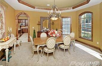 Large formal dining room with octagonal cove ceiling.