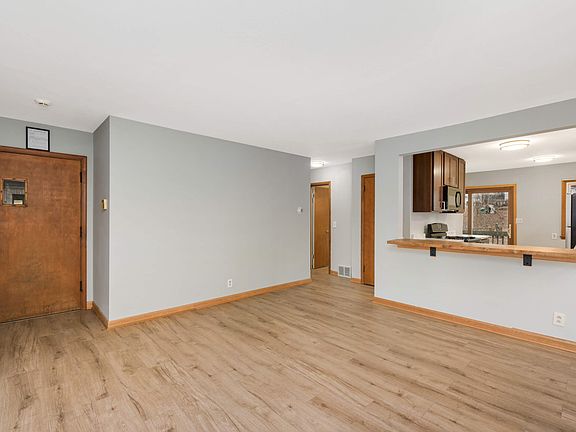 Front living room - view of front door and kitchen area.