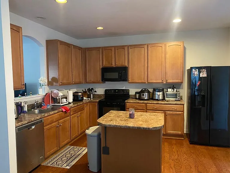Kitchen. Microwave, dishwasher, stove/oven, refrigerator included. Other items shown not included.