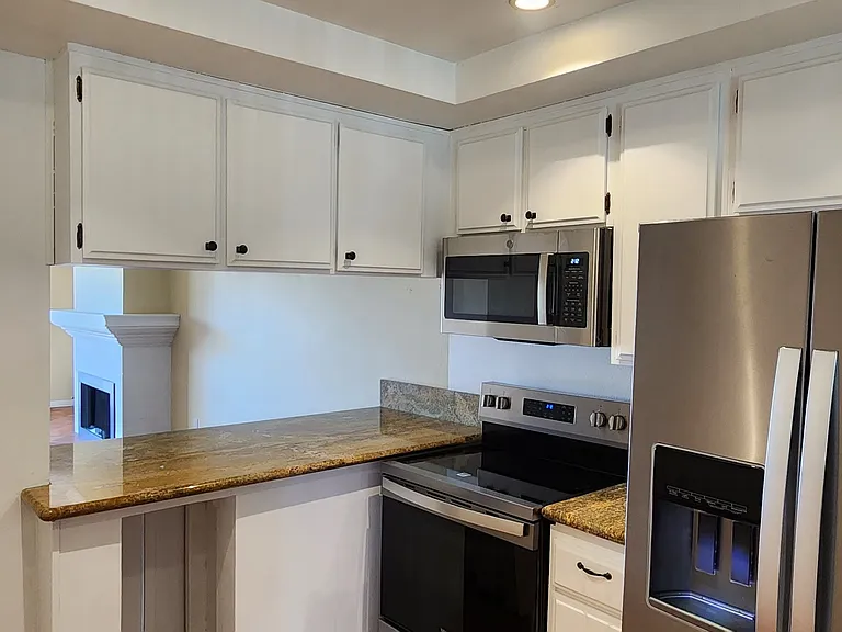 Freshly painted kitchen 
New refrigerator new stove
And microwave plus a dishwasher.