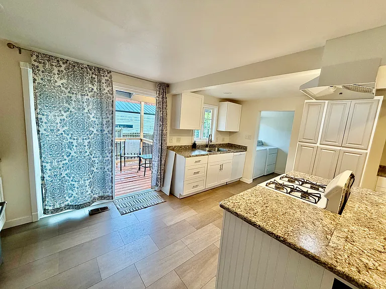 Kitchen to back deck/yard.