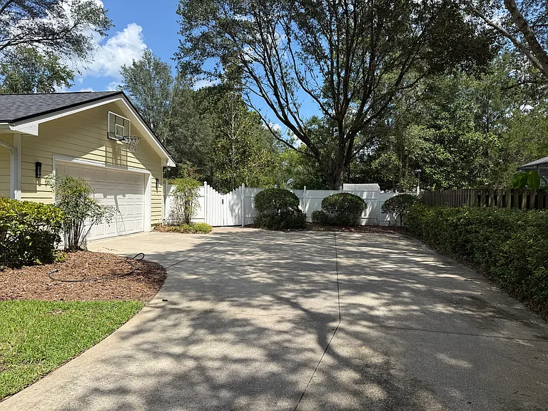 Large driveway with attached 2 car garage