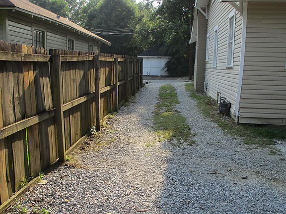 Driveway to 1BR apartment in back of property. For use only by 1BR apartment tenant.