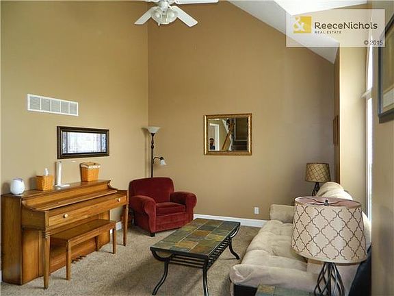 Your entry into the home opens to vaulted ceiling and open walkways to the upstairs. Beautiful living room with gorgeous windows