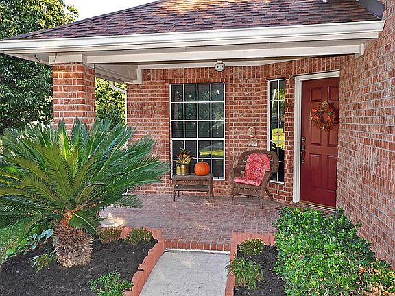 This large, covered patio e welcomes you to 12114 Dover Meadows!
