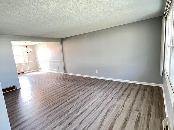 Family Room. Entire unit has fresh paint/new floors