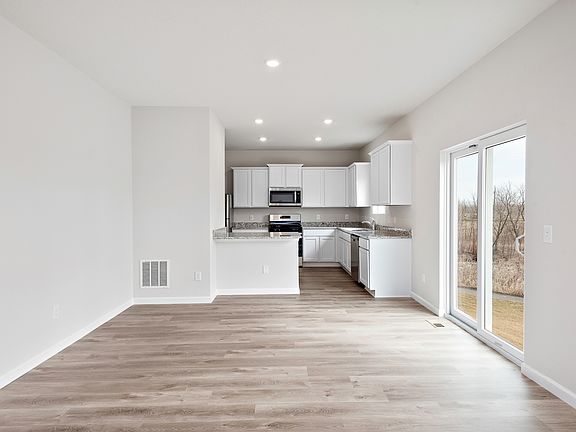 The kitchen is open to the dining room and family room.