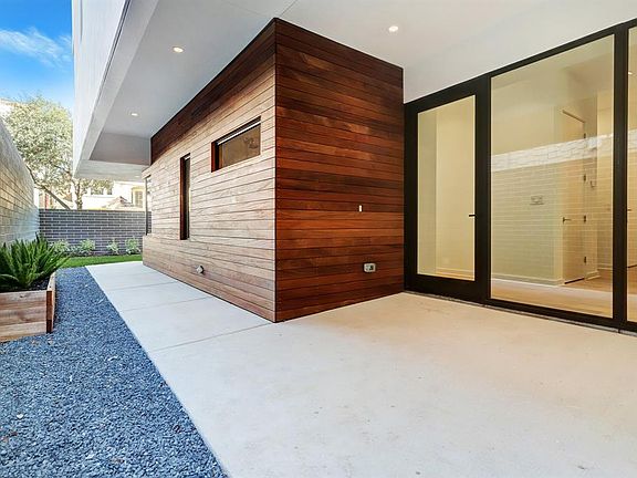 The handsome entry with floor to ceiling windows and front door.