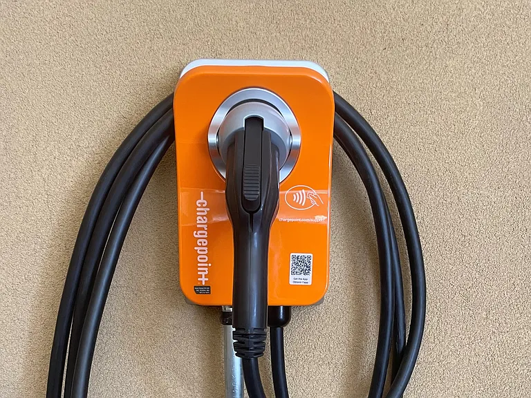 EV-charging parking spaces are available for rent in Fourth Street Flat covered parking