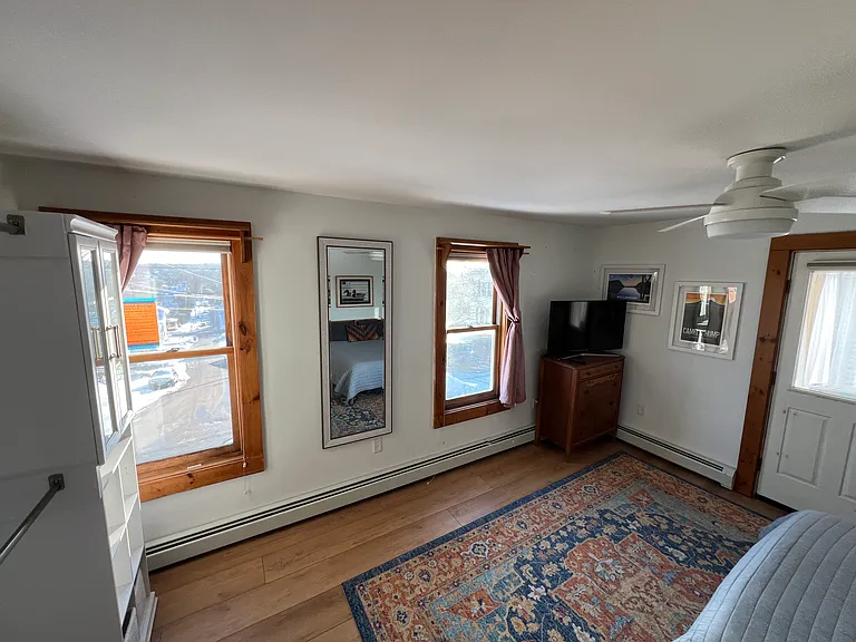 Built-In Closet system and door to 3-Season porch.