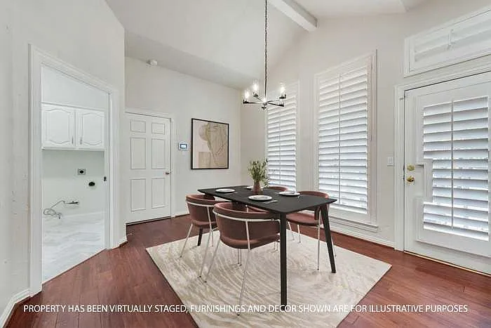 Breakfast area, powder room and laundry room with sink complete this space