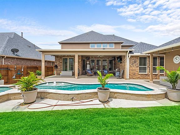Back of the house showing covered patio.