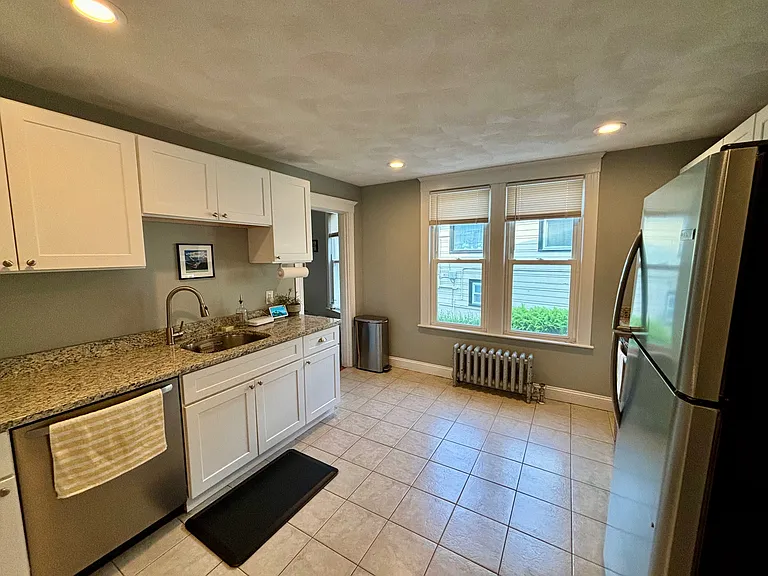 Newly renovated kitchen with white shaker cabinets, granite counter tops and stainless steel appliances!