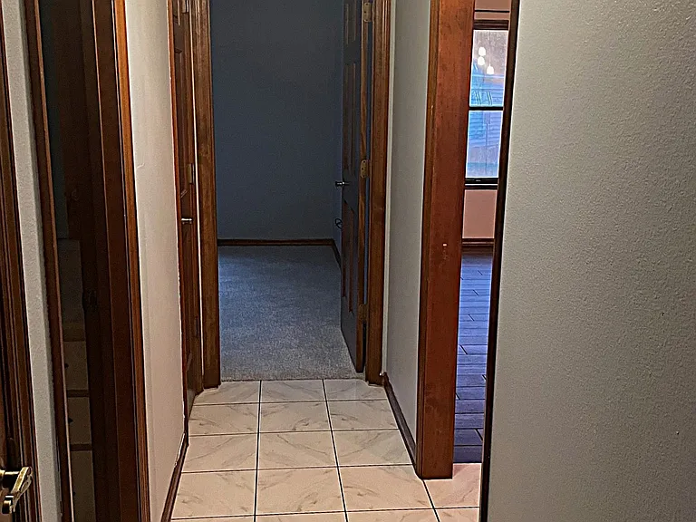 Hallway between guest bath and 2nd & 3rd bedrooms - A pocket door closes this side of the house off from the rest of the house! Privacy!