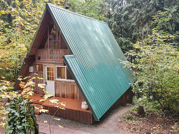 2 storage spaces accessed on side of home.>