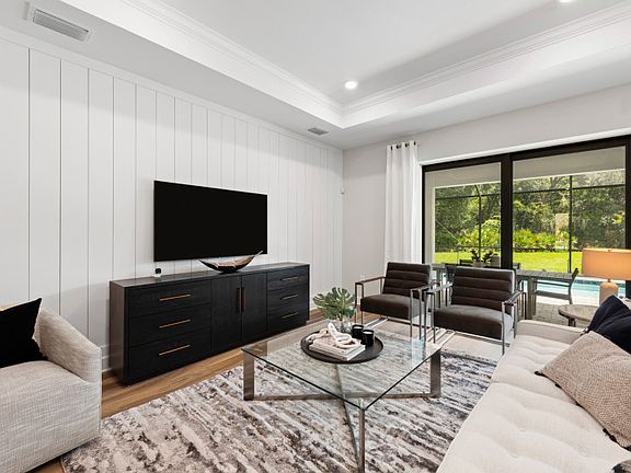 Model Representation Spacious gathering room with decorative tray ceiling
