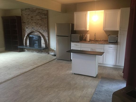 Kitchenette with countertop oven and burner