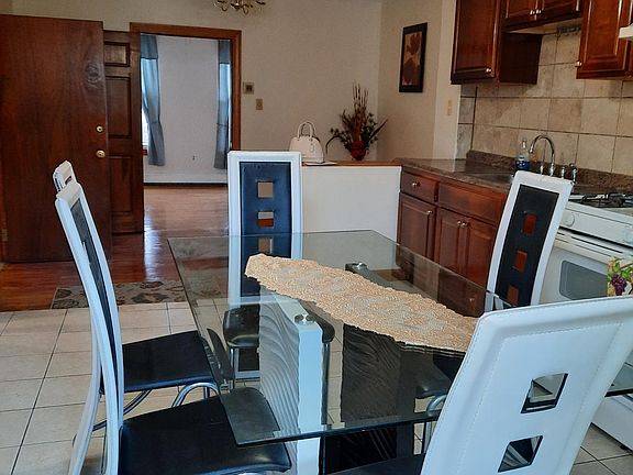 Kitchen into living area and bedroom