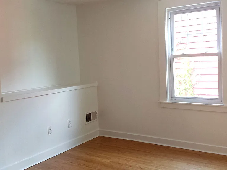 15. Large tiled shower w/ lots of shelves and seat