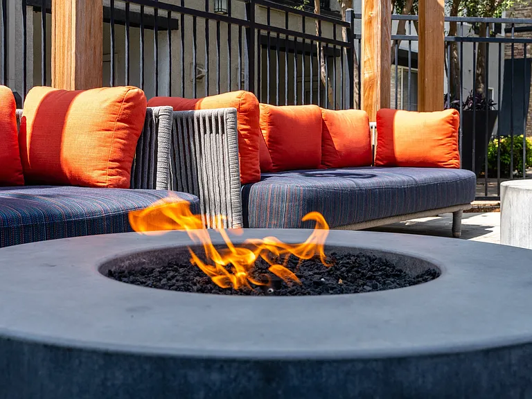 Modern Patio Fire Table with Flame Feature and Cozy Lounge Seating