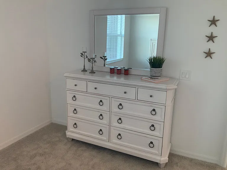Master bedroom with new furniture and plenty of storage with two walk-in closets