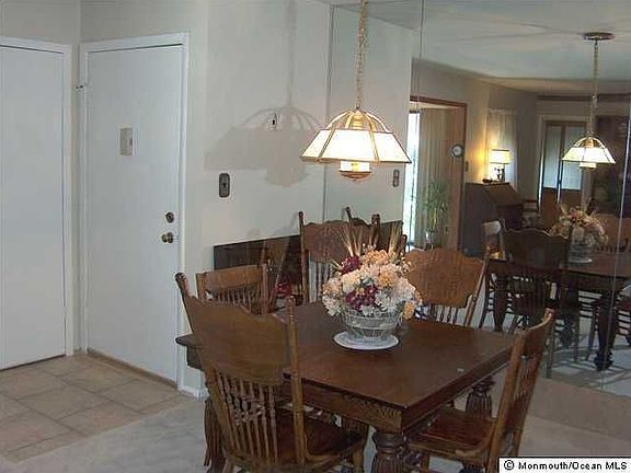 Dining Room with full mirror wall