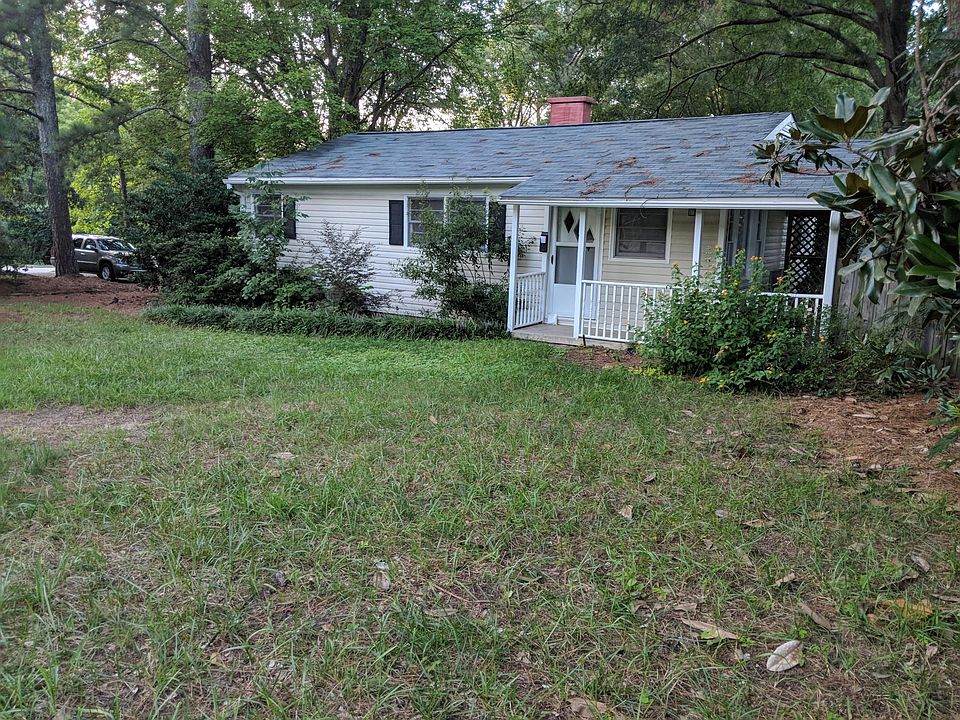 Large corner lot. Covered front porch for swing or chairs. P