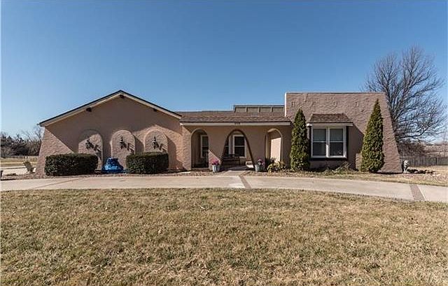 Welcome to 408 S Silver Top Lane, Raymore, MO Appreciate the elegance of this Classic Spanish Style!