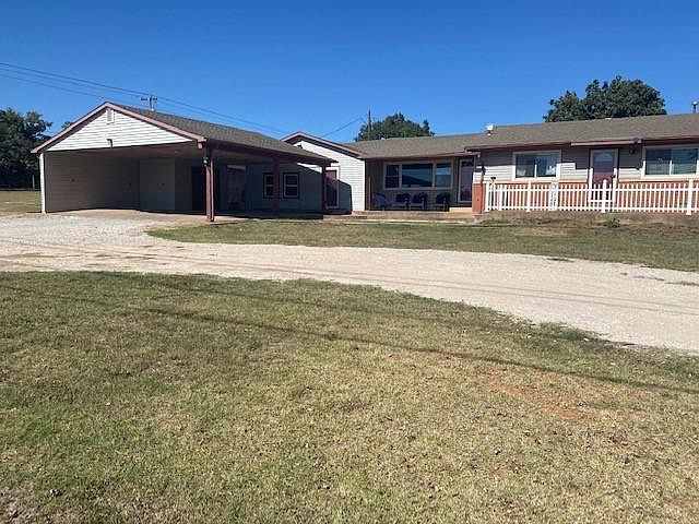 Front of house - circle drive carport
