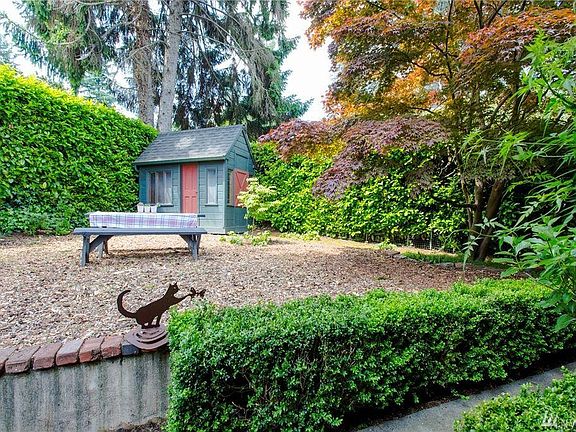 Sunny play area and garden shed.