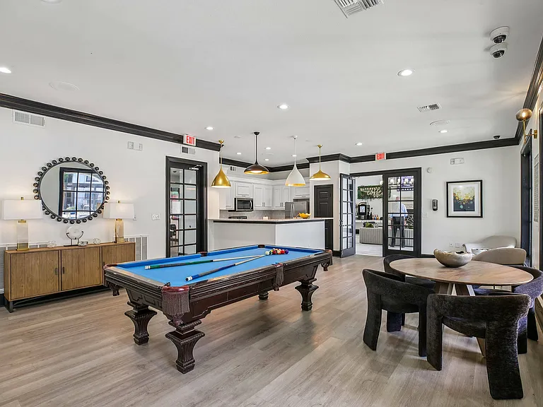 Relax and unwind in the Providence Uptown resident lounge featuring a modern gaming area and media entertainment.