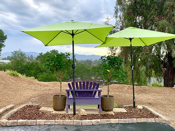At the end of the driveway, a sitting area to relax and view the mountains.