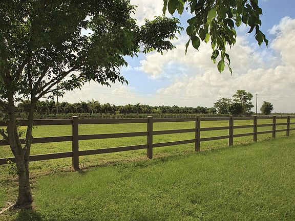 fencing and green pastures