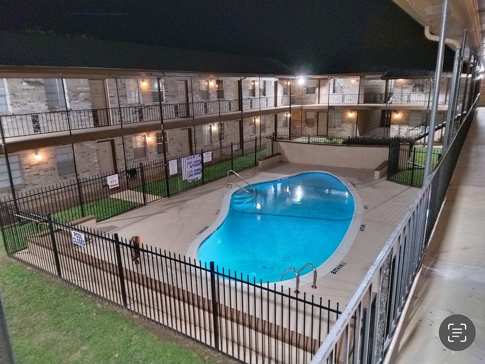 This is the community Pool at night showing the bright lights.