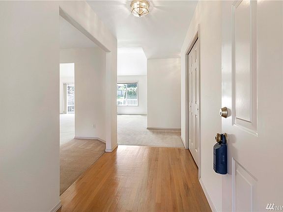 Hardwood floors in entry.