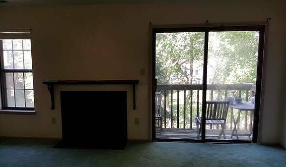 Living Room view of Fireplace and Patio