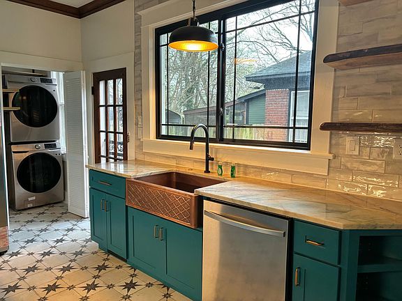 Kitchen view with live edge shelving, side entrance.